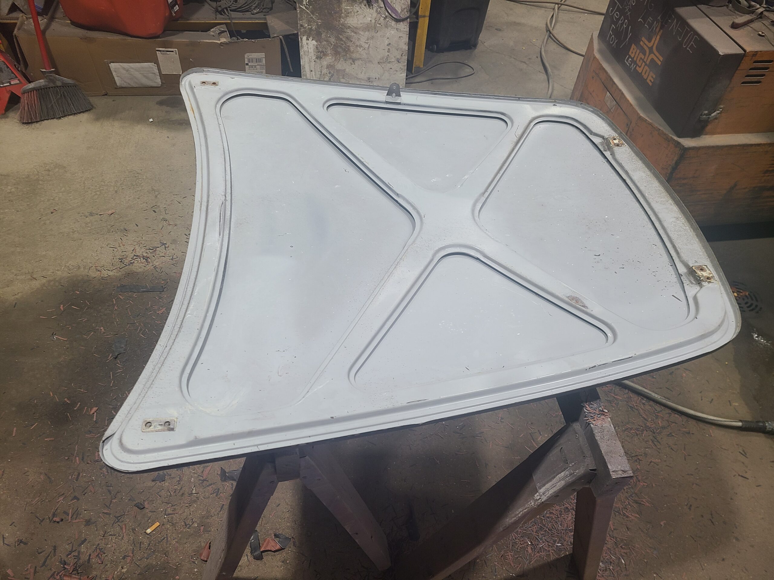 Finished metal panel on a work stand
